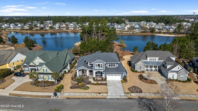 aerial view with a residential view and a water view