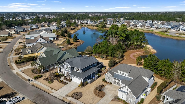 aerial view featuring a residential view and a water view