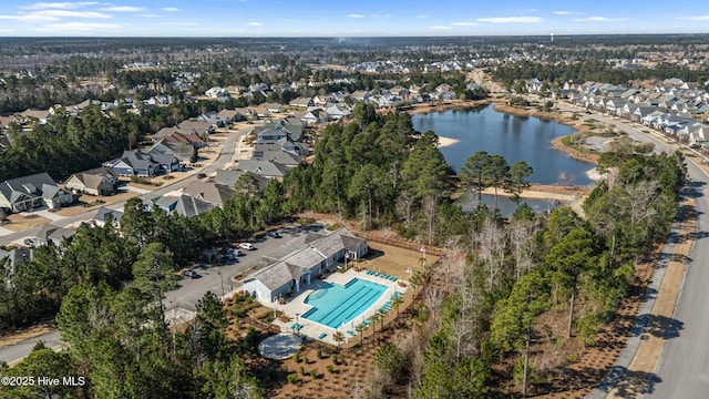 birds eye view of property featuring a residential view and a water view