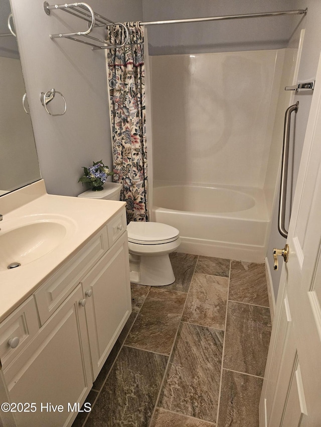 full bathroom with toilet, vanity, and shower / bath combination with curtain