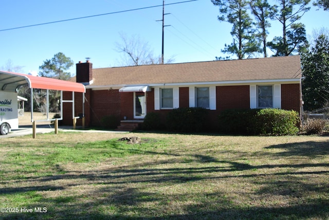 ranch-style home featuring a carport and a front yard