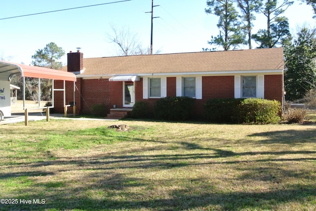 single story home featuring a carport and a front lawn