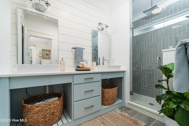 bathroom featuring vanity, crown molding, and walk in shower