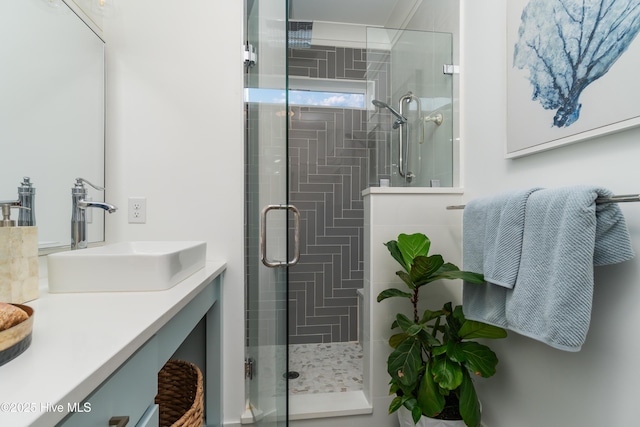 bathroom featuring vanity and walk in shower