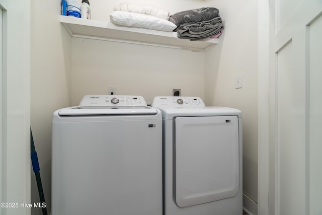 laundry area featuring washing machine and clothes dryer