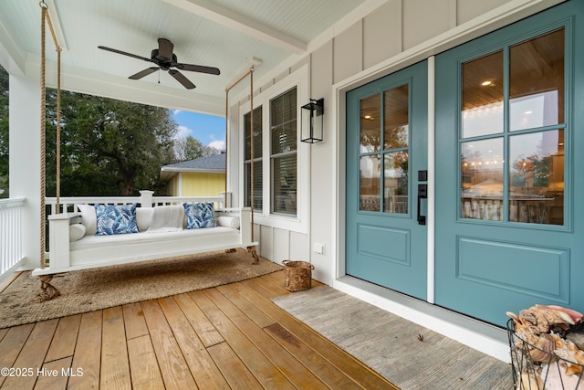 exterior space with ceiling fan and a porch