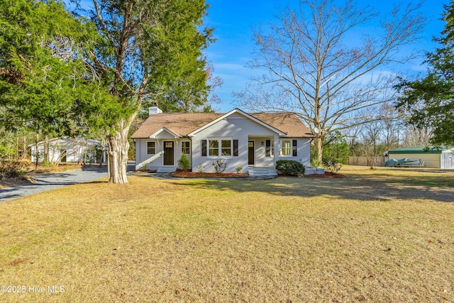 ranch-style house with a front lawn