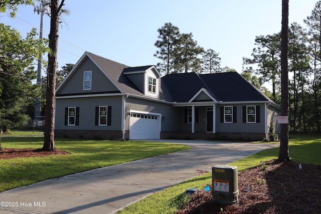 11 Pine Shore Dr, Southport, NC 28461 - view of front of home featuring asphalt driveway, a garage, and a front lawn