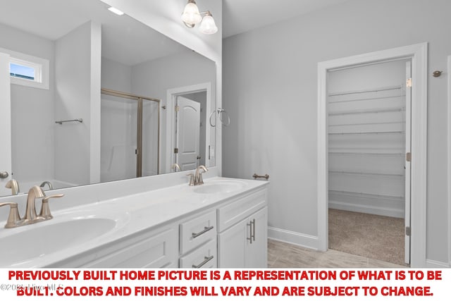 11 Pine Shore Dr, Southport, NC 28461 - full bath featuring a stall shower, double vanity, and baseboards