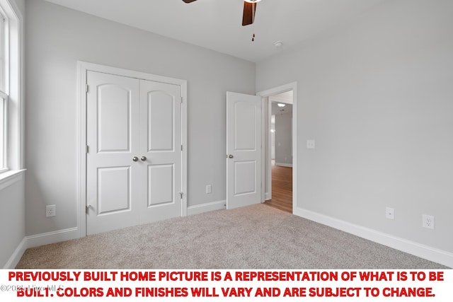 11 Pine Shore Dr, Southport, NC 28461 - unfurnished bedroom with carpet floors, a closet, baseboards, and a ceiling fan