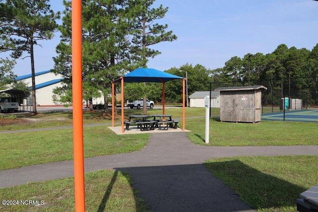 11 Pine Shore Dr, Southport, NC 28461 - view of community featuring a lawn and a carport
