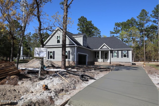 11 Pine Shore Dr, Southport, NC 28461 - view of front facade featuring covered porch and roof with shingles