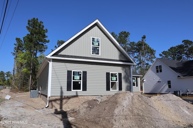 11 Pine Shore Dr, Southport, NC 28461 - view of front facade with central AC and board and batten siding
