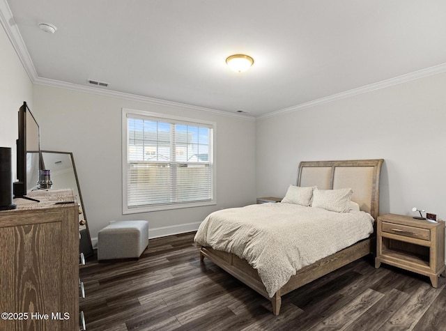 bedroom with dark hardwood / wood-style flooring and crown molding