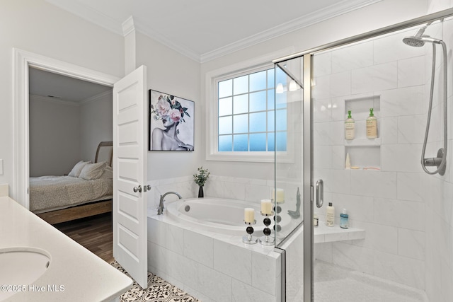 bathroom featuring vanity, hardwood / wood-style flooring, ornamental molding, and separate shower and tub