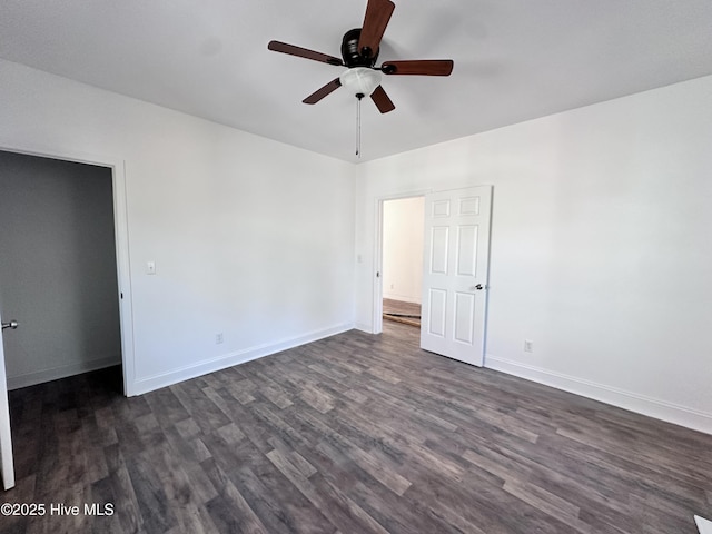 unfurnished bedroom featuring ceiling fan, dark wood finished floors, and baseboards