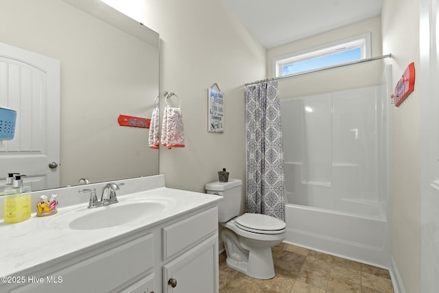 bathroom with shower / bath combo, vanity, and toilet