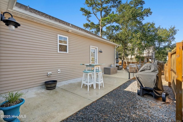view of patio / terrace featuring fence