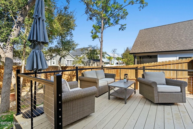 wooden deck featuring fence and an outdoor hangout area