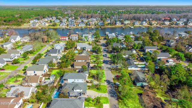 bird's eye view featuring a residential view and a water view