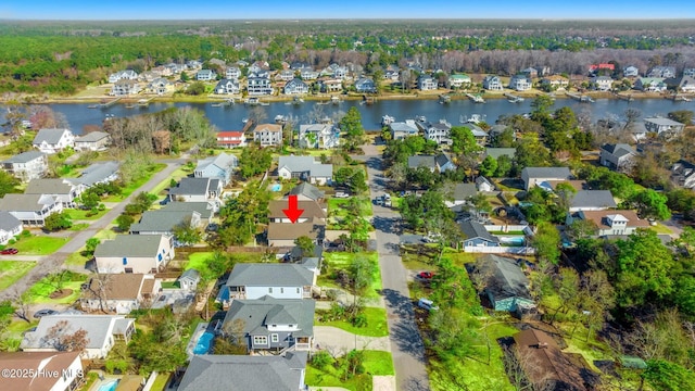bird's eye view featuring a residential view and a water view