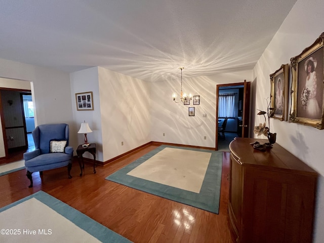 interior space with hardwood / wood-style floors and a notable chandelier