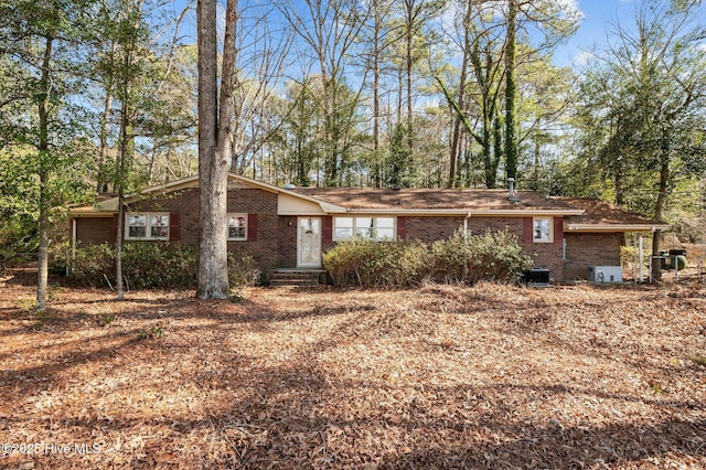 single story home with entry steps and brick siding