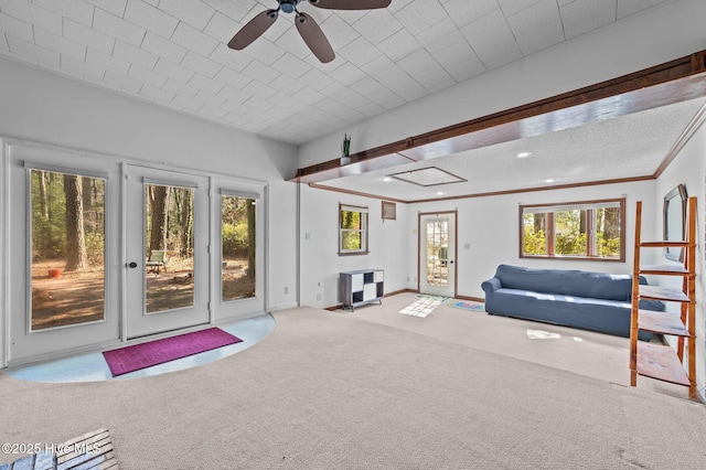 unfurnished living room featuring crown molding, recessed lighting, light colored carpet, ceiling fan, and baseboards