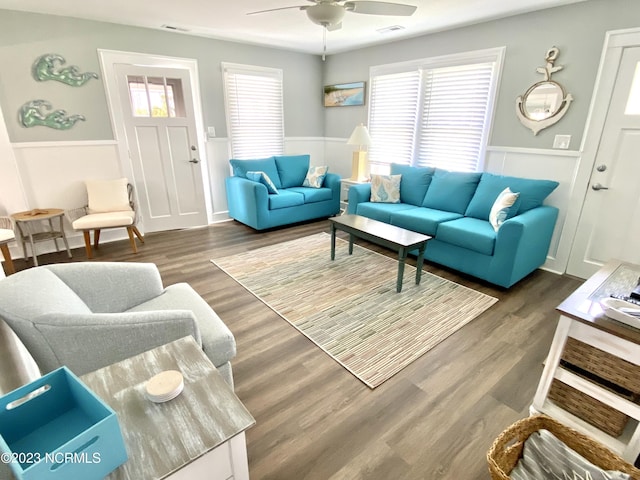 living room featuring dark hardwood / wood-style floors and ceiling fan