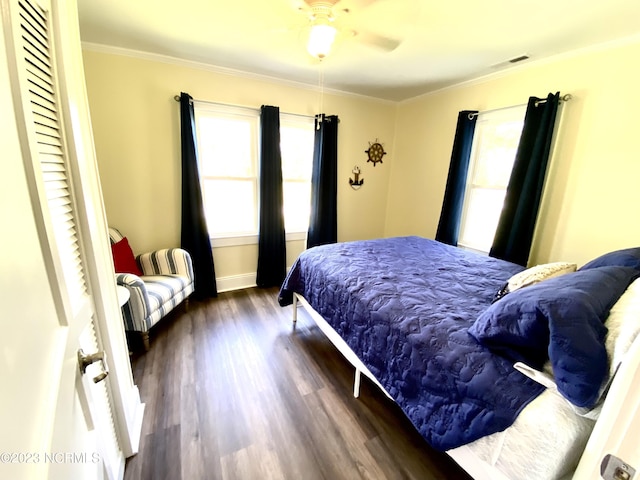 bedroom featuring ornamental molding and dark hardwood / wood-style floors