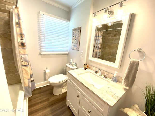 full bathroom featuring shower / tub combo with curtain, crown molding, vanity, wood-type flooring, and toilet