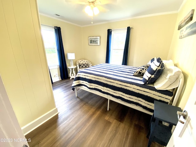 bedroom featuring dark wood-type flooring and ornamental molding