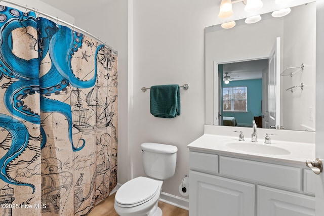 bathroom with vanity, hardwood / wood-style flooring, a shower with curtain, and toilet