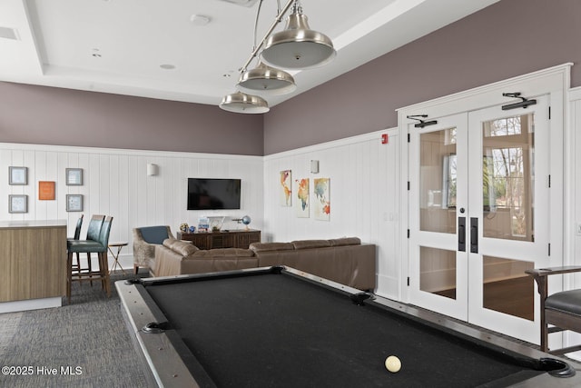 playroom featuring a wainscoted wall, pool table, and french doors