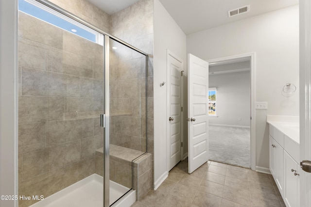 full bathroom featuring visible vents, a healthy amount of sunlight, and a stall shower