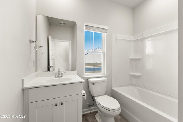 full bath featuring vanity, toilet, baseboards, and visible vents