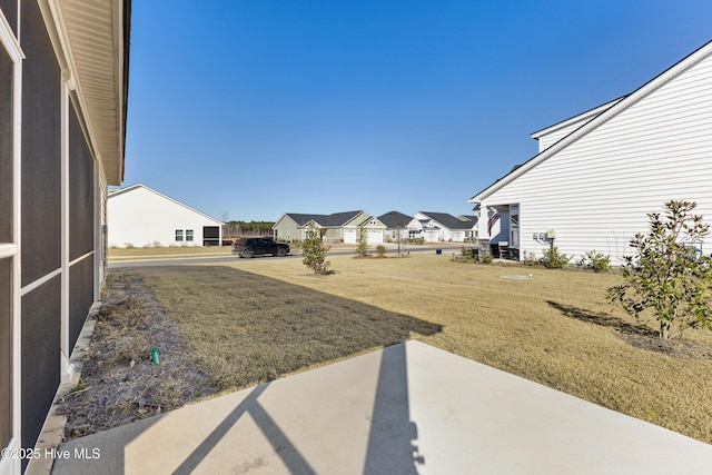 view of yard featuring a residential view