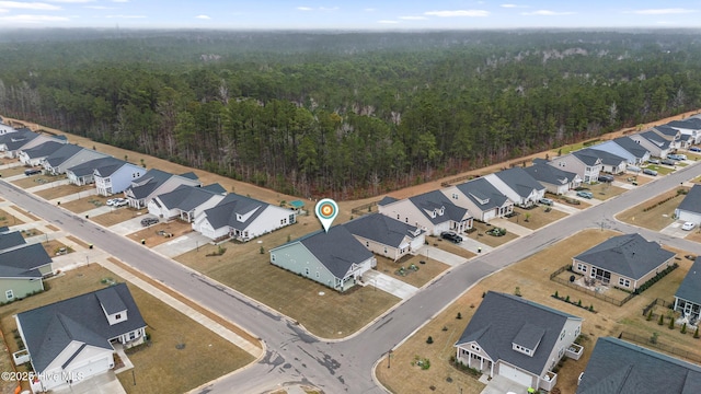 aerial view with a forest view and a residential view