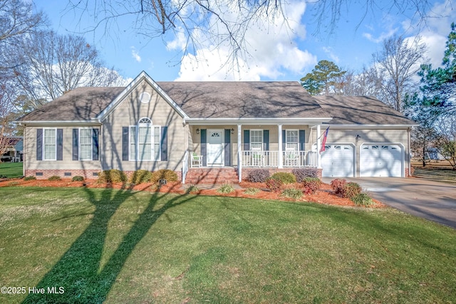 view of front of house with a garage, a front yard, and covered porch