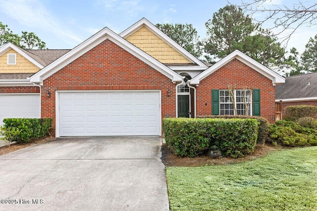 traditional-style house featuring brick siding, driveway, and a garage