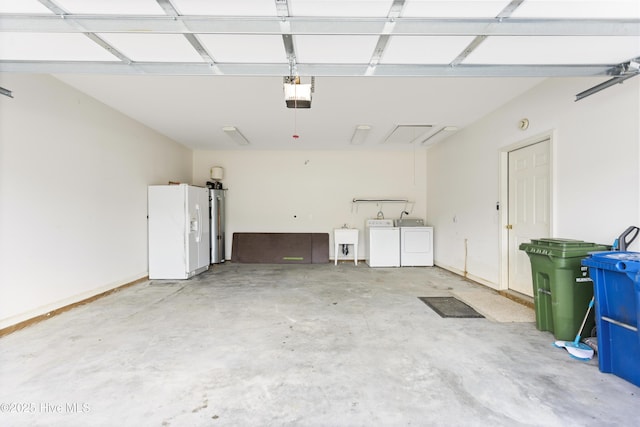 garage with white fridge with ice dispenser, washer and dryer, a garage door opener, and a sink