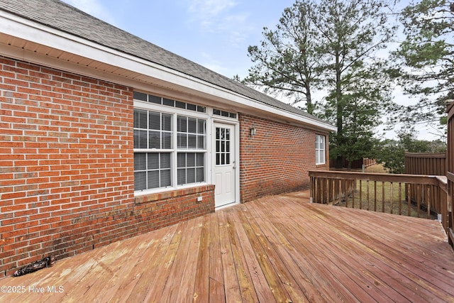 wooden deck featuring fence