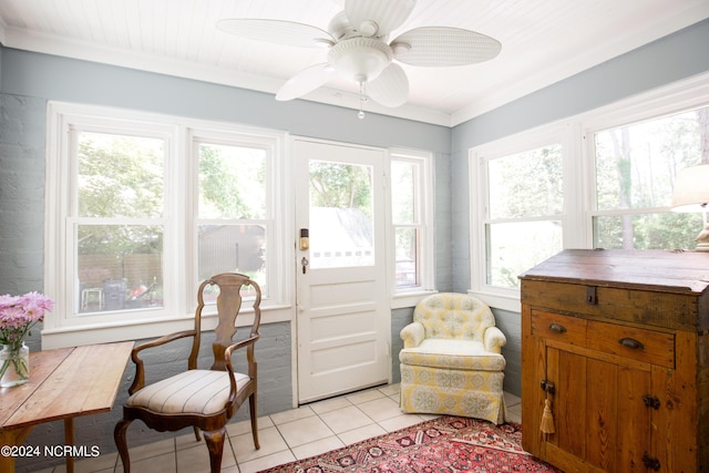 living area featuring light tile patterned floors and ceiling fan