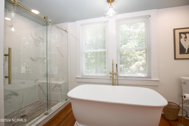 bathroom featuring independent shower and bath and hardwood / wood-style floors