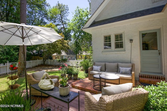 wooden deck featuring an outdoor living space