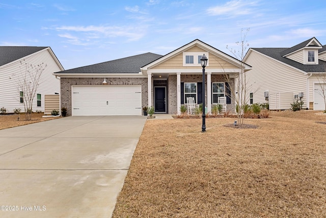 view of front of home with a garage and covered porch