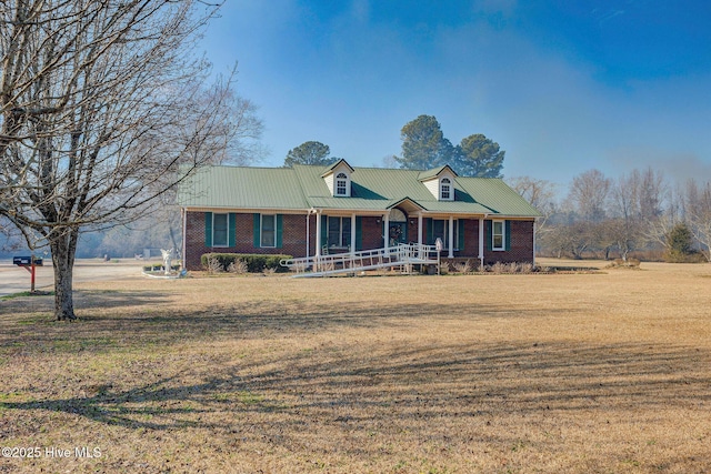 view of front facade with covered porch and a front lawn