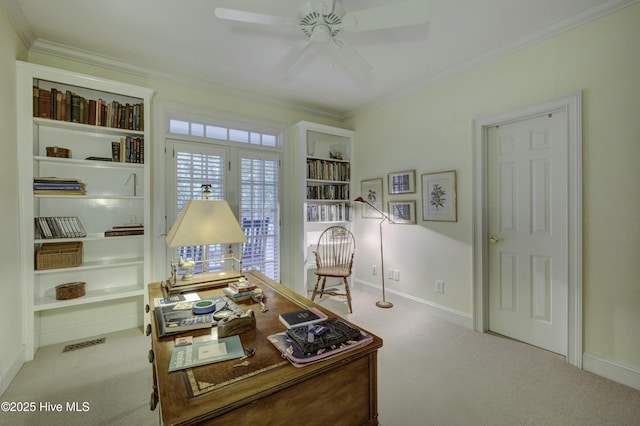 carpeted office space featuring ornamental molding and ceiling fan