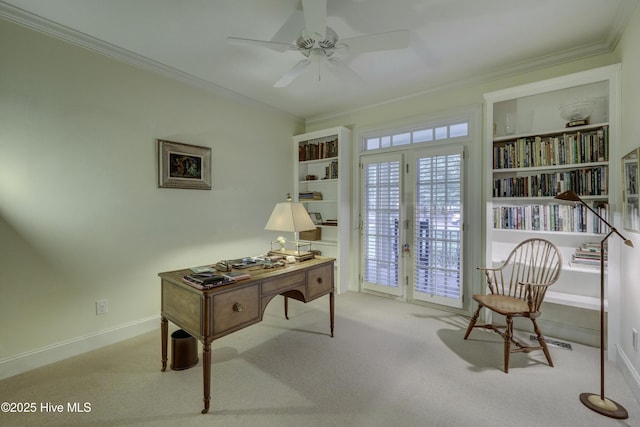 home office featuring crown molding, light colored carpet, and ceiling fan