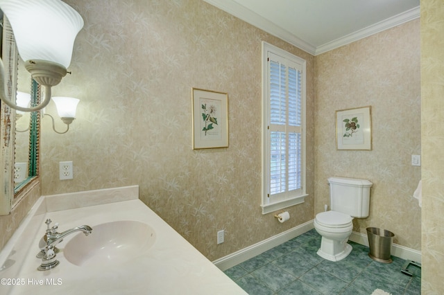 bathroom with tile patterned flooring, crown molding, vanity, and toilet